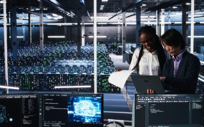 Data center engineers managing AI systems for uptime and efficiency, looking over paperwork files. African american woman and Asian man reading documents in multiethnic server hub, camera A