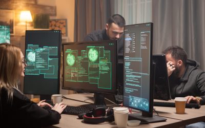 Female hacker with her team of cyber terrorists making a dangerous virus to attack the government.